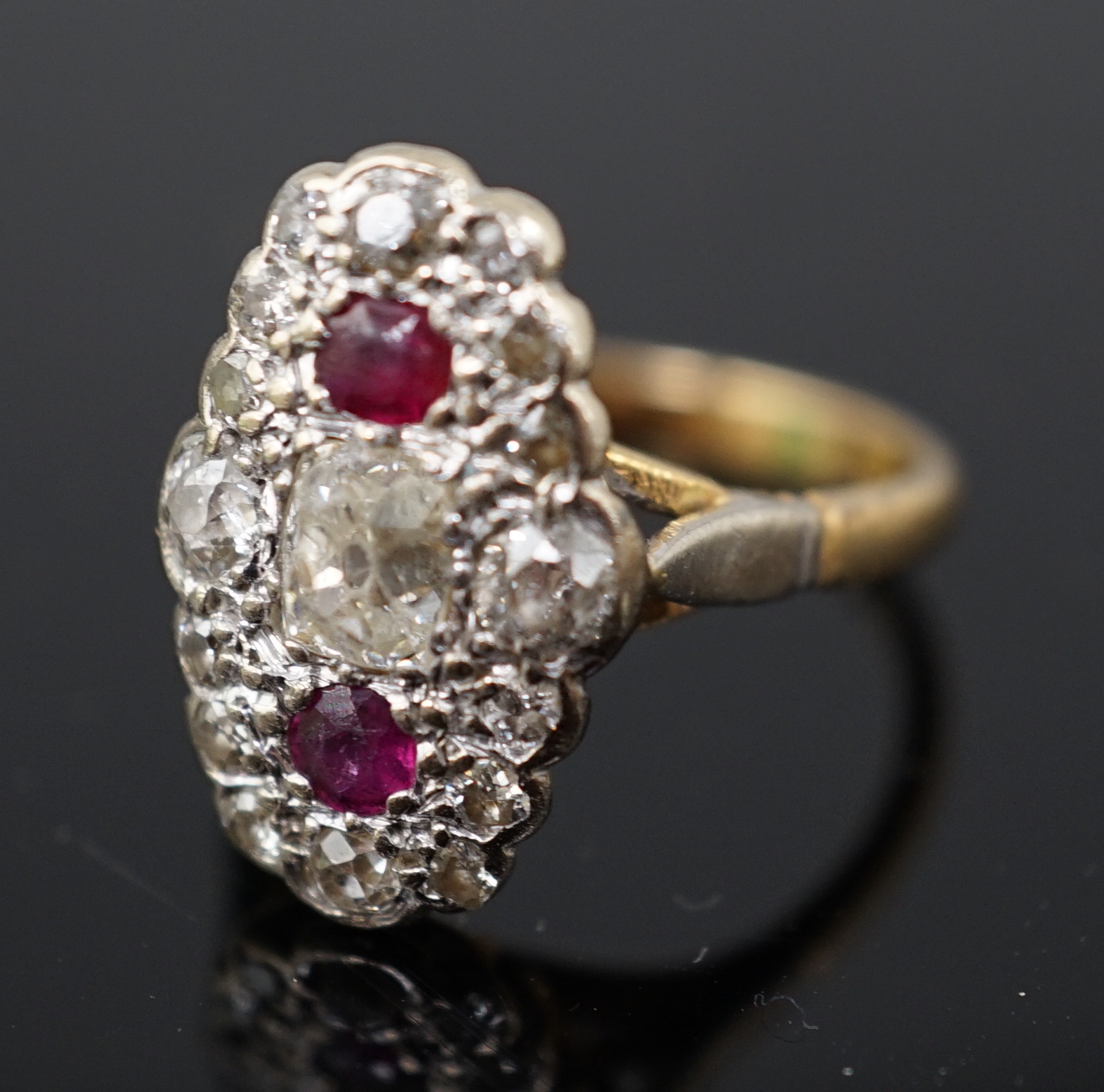 An 18ct gold ruby and diamond cluster ring